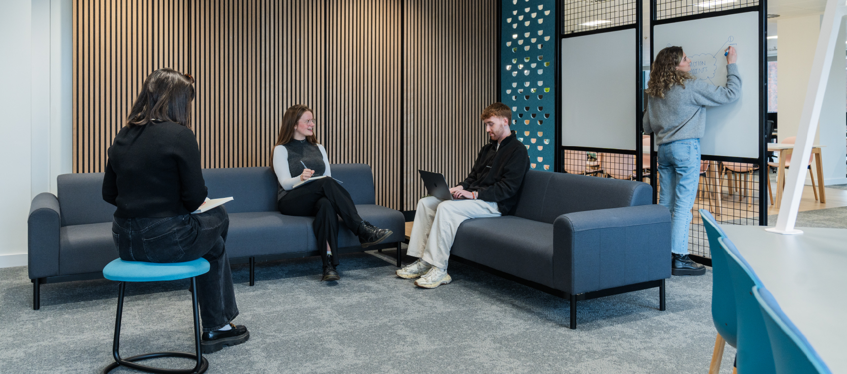 Calibro Workspace - Designing a Hybrid Workplace - Colleagues sitting in a collaborative space