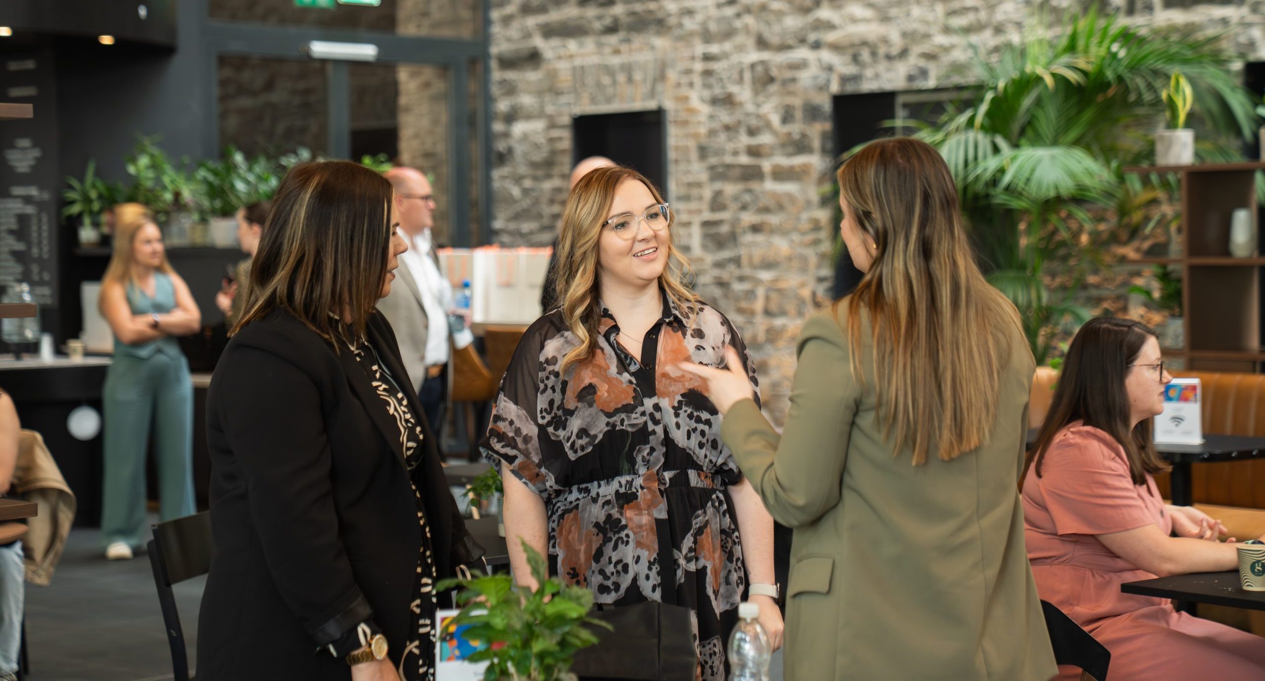 attendees of workplace wellbeing event networking together 