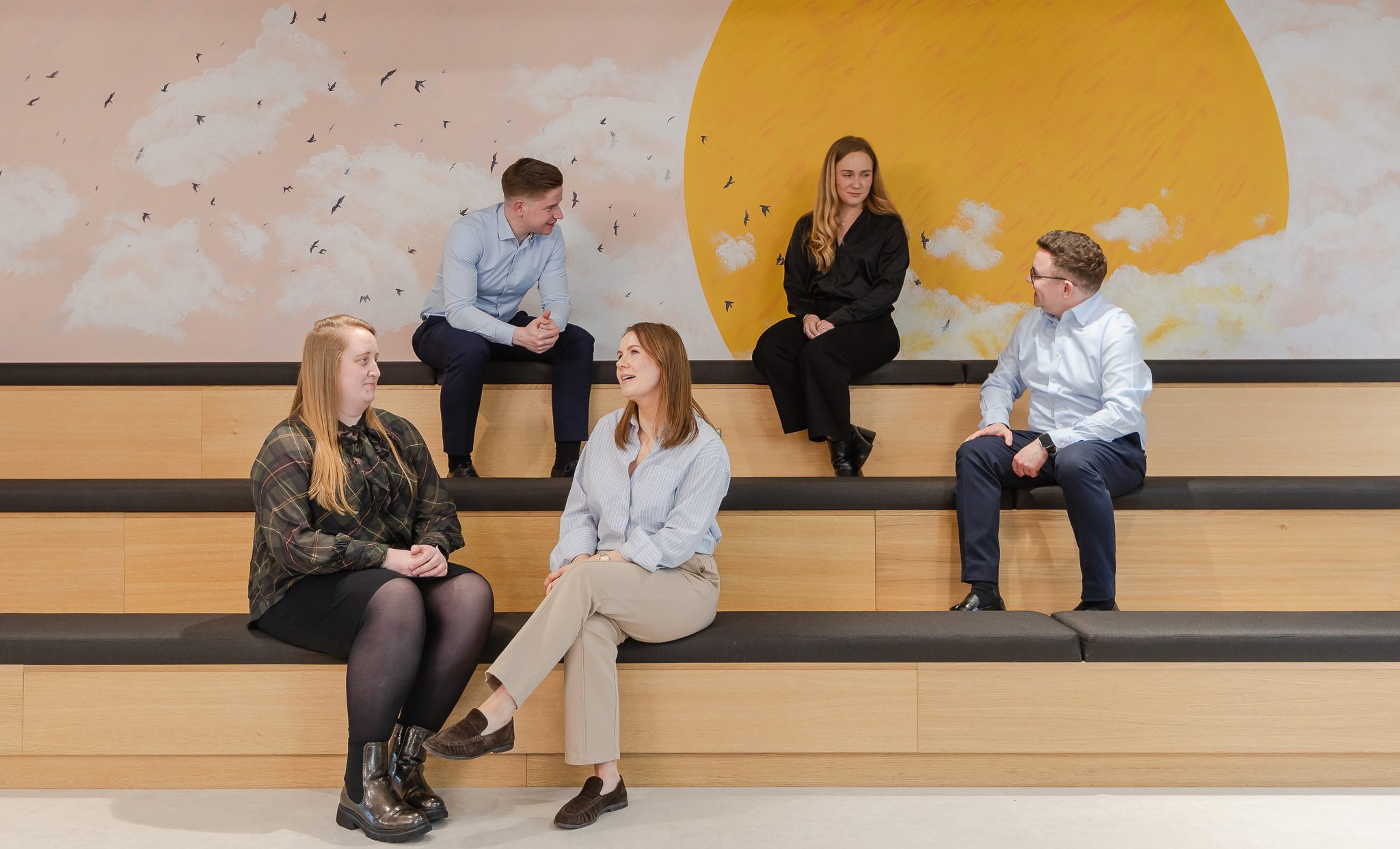 employees relaxing in breakout area and having conversations