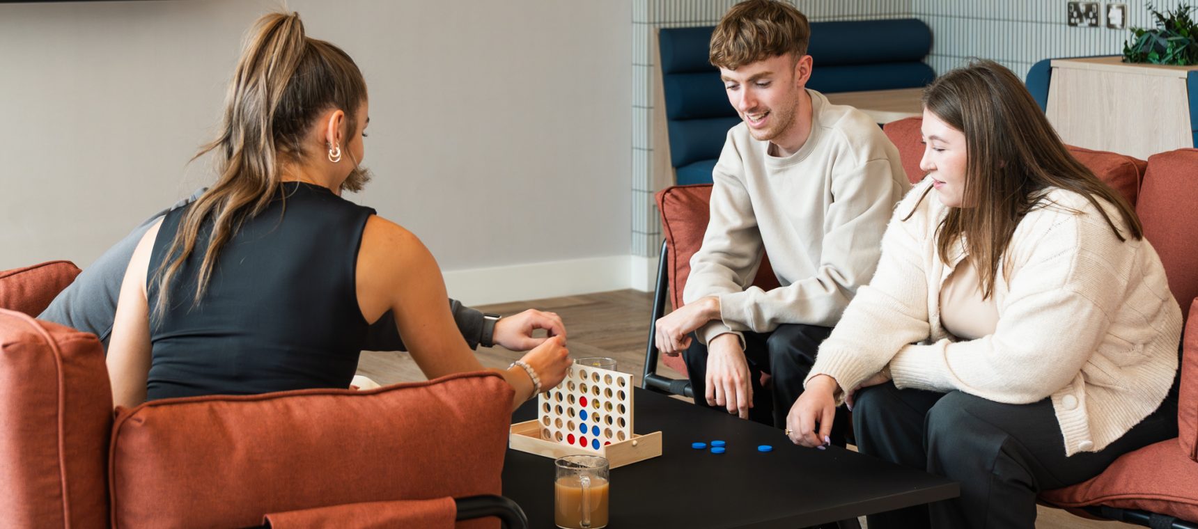 co-workers connecting together in breakout area