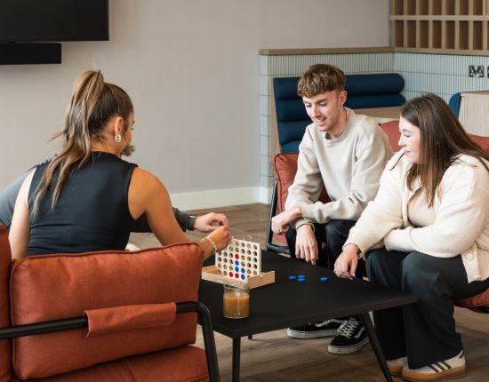 co-workers connecting together in breakout area