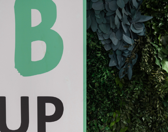 Brand sign featuring preserved planting