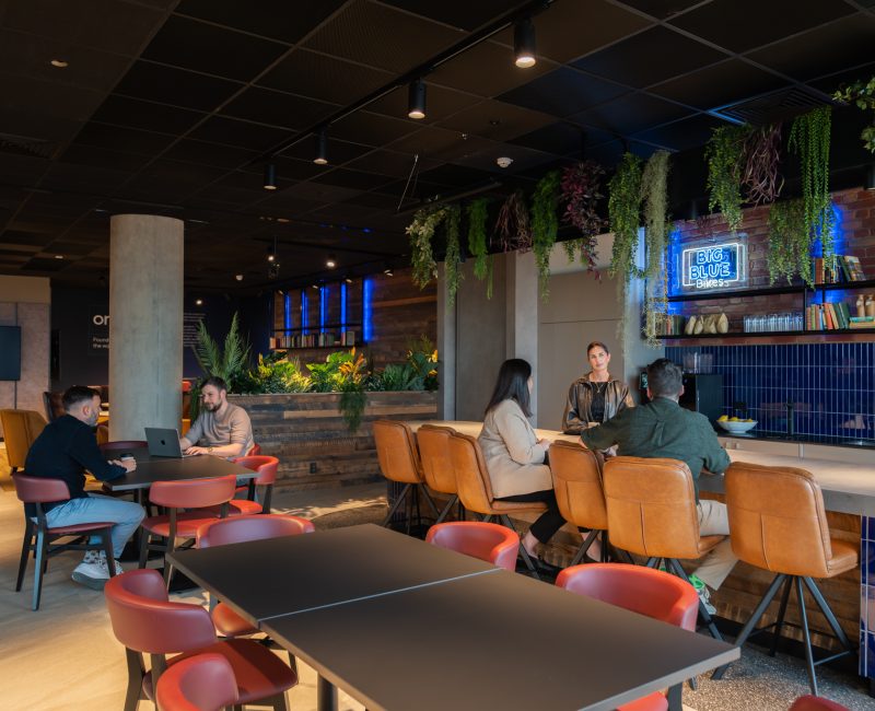 Origina office design and fitout - coworkers socialising in breakout space